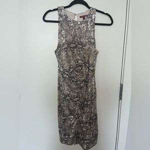 Sequenced dress with peekaboo keyhole​